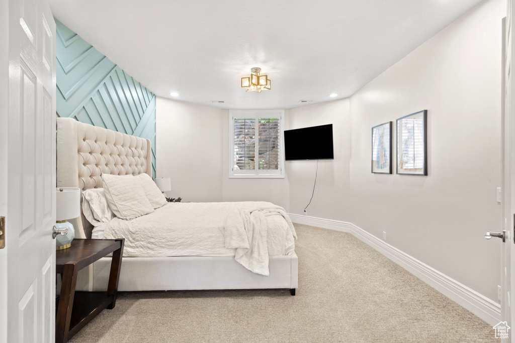 Carpeted bedroom with baseboards and recessed lighting