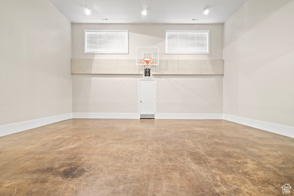 View of basketball court featuring basketball hoop