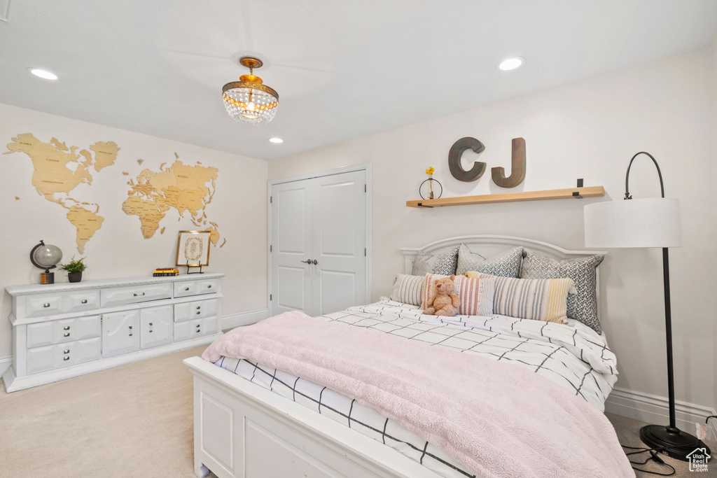 Bedroom with baseboards, recessed lighting, and light carpet