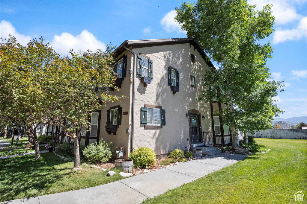View of front facade featuring stucco siding