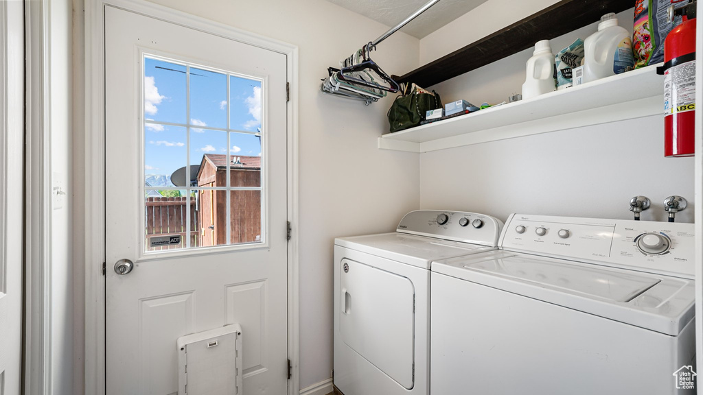 Clothes washing area featuring independent washer and dryer
