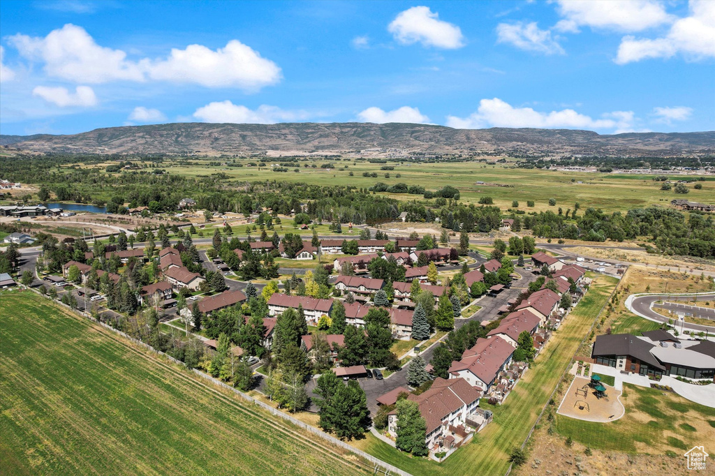 Aerial view of property's location with a mountain backdrop