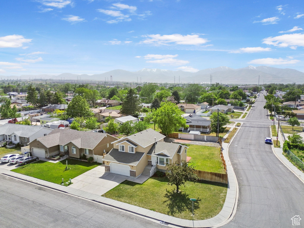 Aerial view of residential area with a mountainous background