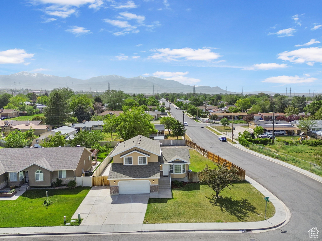 Aerial view of residential area with a mountainous background