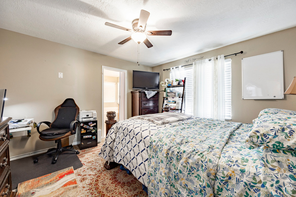 Bedroom featuring baseboards and a ceiling fan