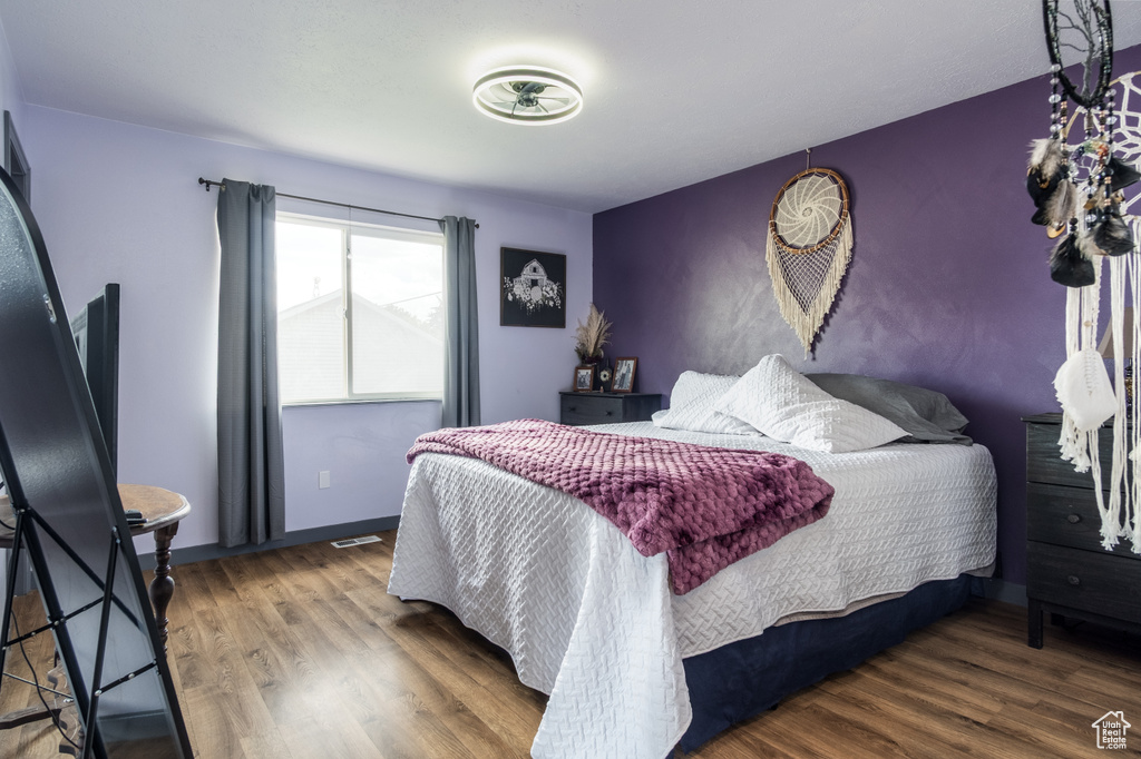 Bedroom with wood finished floors