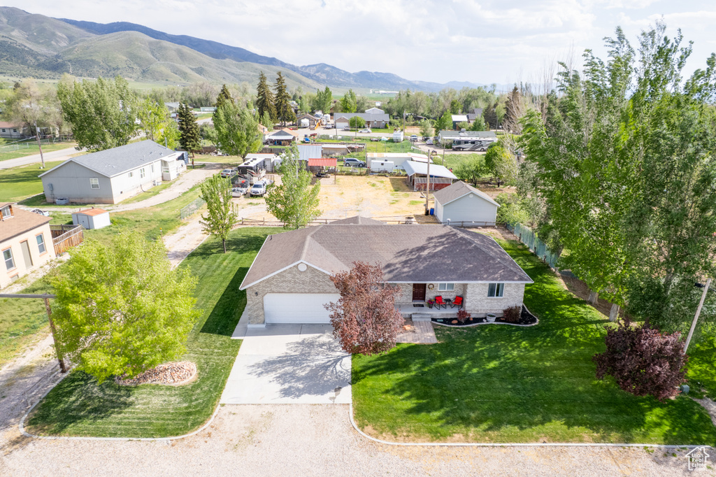 Aerial perspective of suburban area with a mountainous background