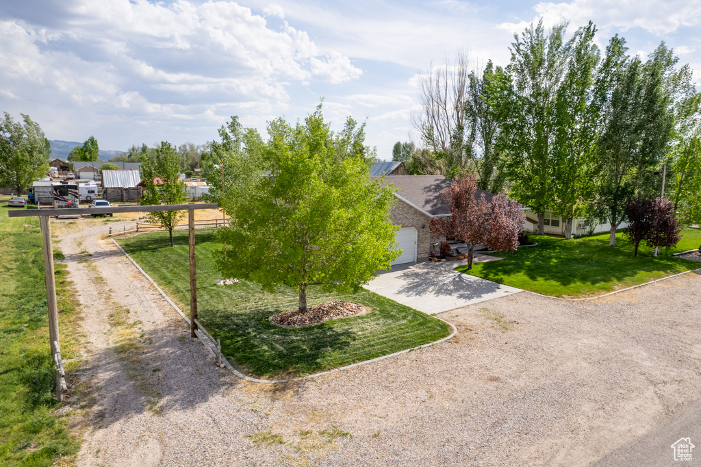 View of front of house featuring driveway and a garage