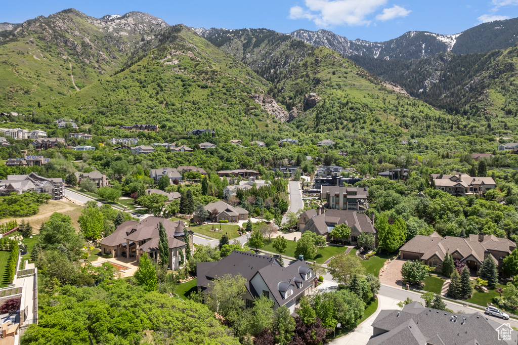 Aerial perspective of suburban area with a mountainous background