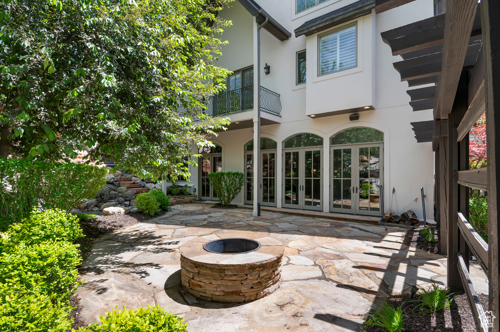 View of patio / terrace with an outdoor fire pit and french doors