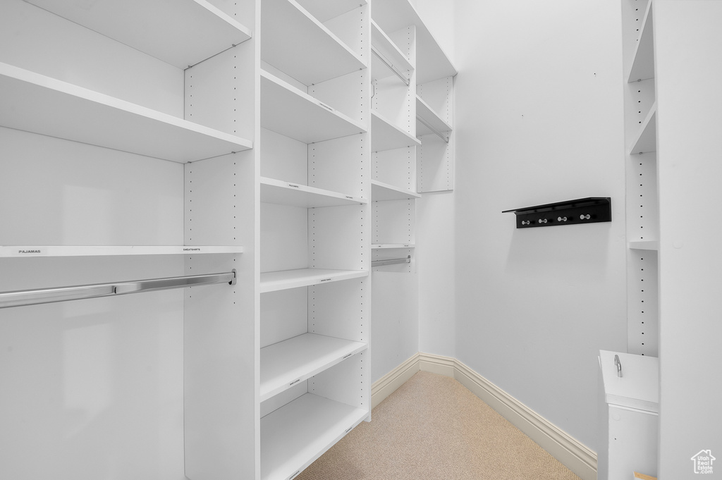 Spacious closet with carpet floors