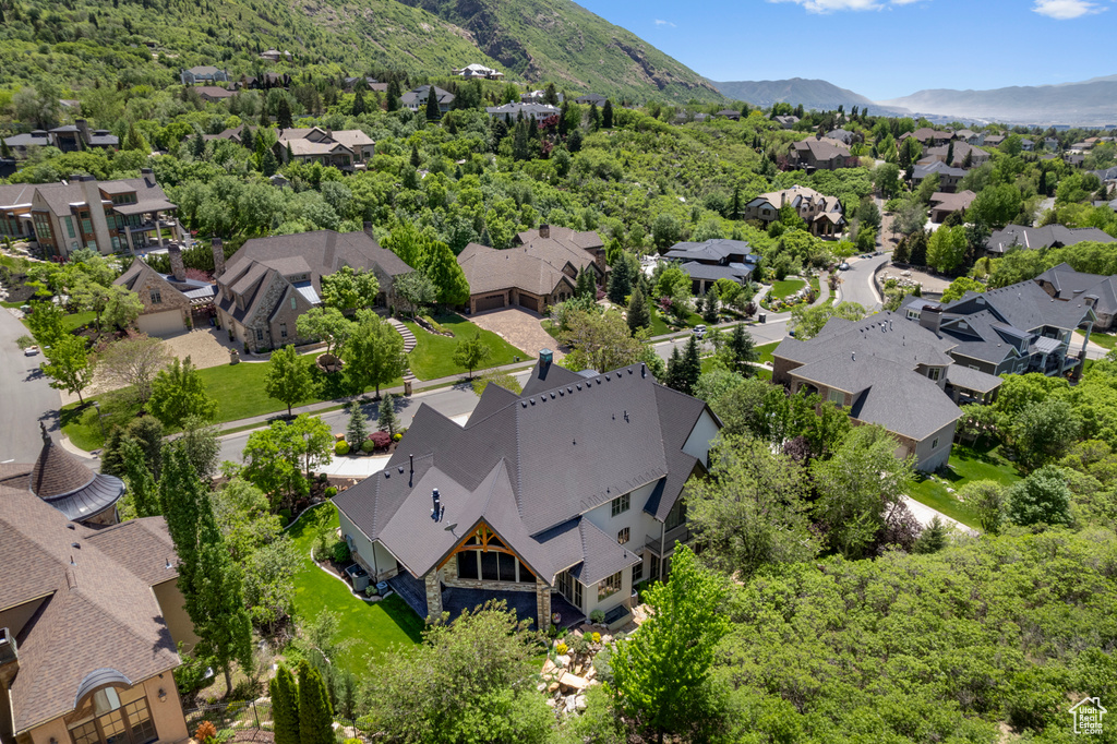 Aerial perspective of suburban area featuring a mountain backdrop