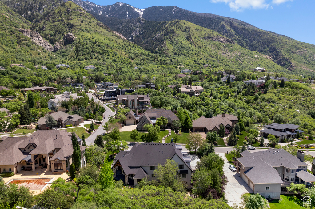 Aerial view of residential area featuring mountains