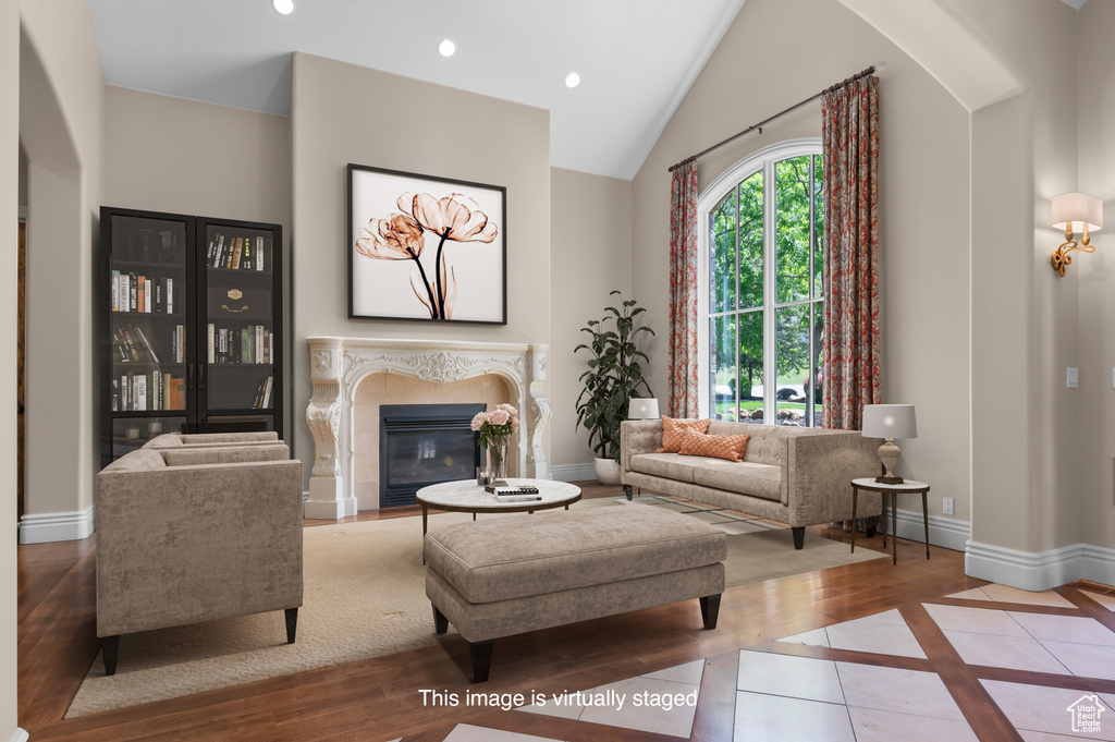 Tiled living room with baseboards, a fireplace, recessed lighting, high vaulted ceiling, and arched walkways