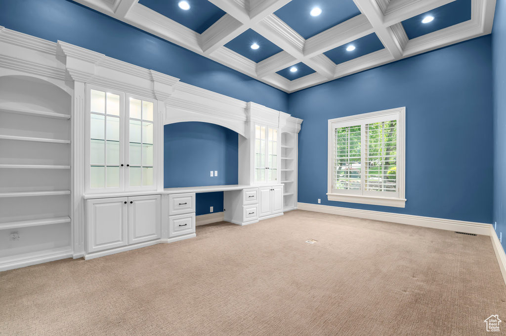 Unfurnished bedroom with light colored carpet, recessed lighting, coffered ceiling, beam ceiling, and baseboards