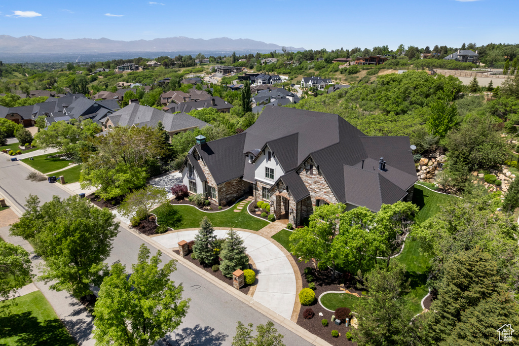 Aerial perspective of suburban area with a mountain backdrop