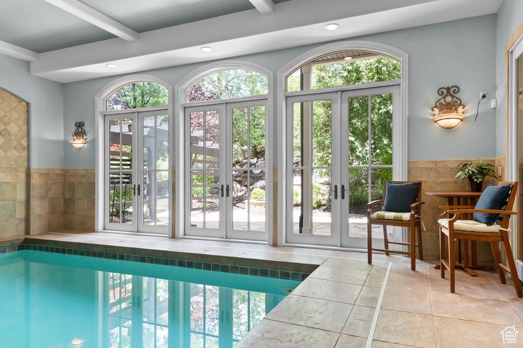 View of swimming pool with french doors