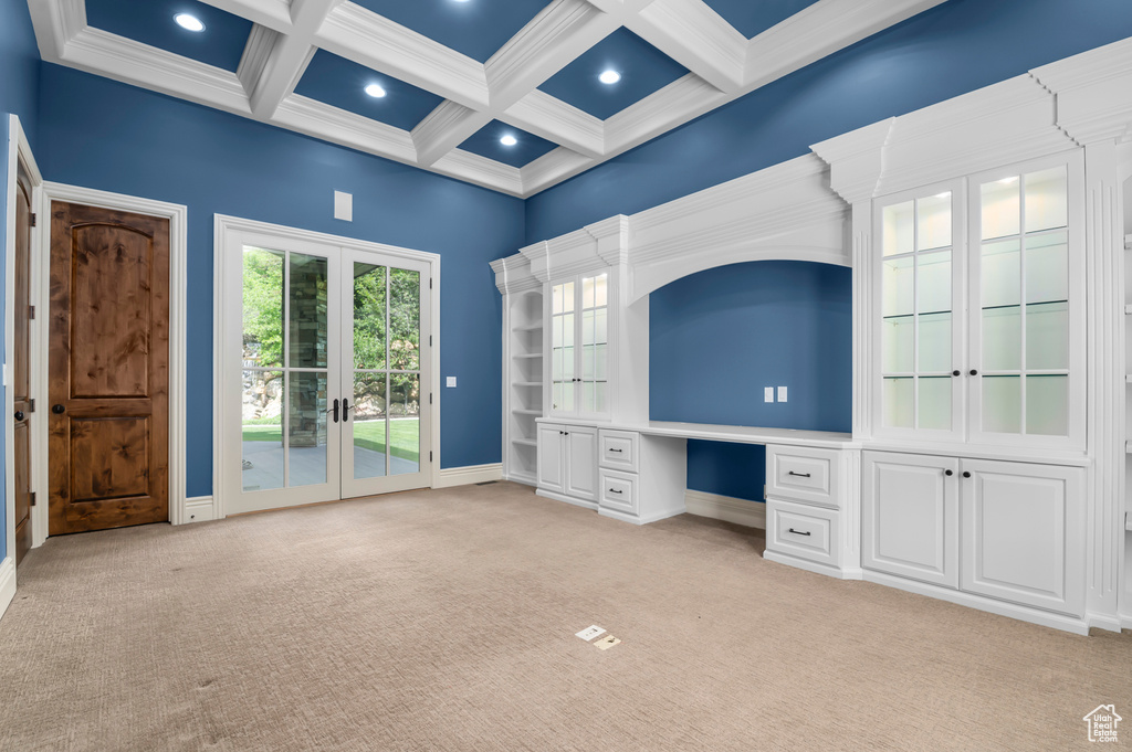 Unfurnished bedroom with access to exterior, french doors, light colored carpet, beamed ceiling, and coffered ceiling