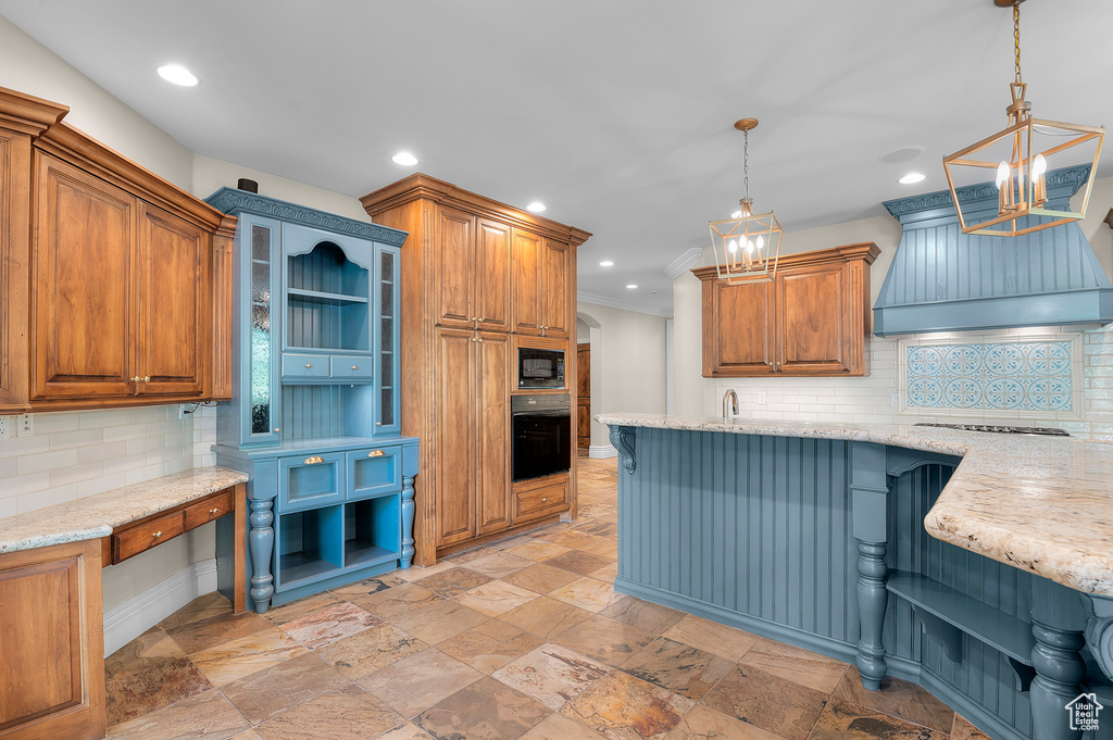 Kitchen with black appliances, stone tile floors, tasteful backsplash, recessed lighting, and a chandelier