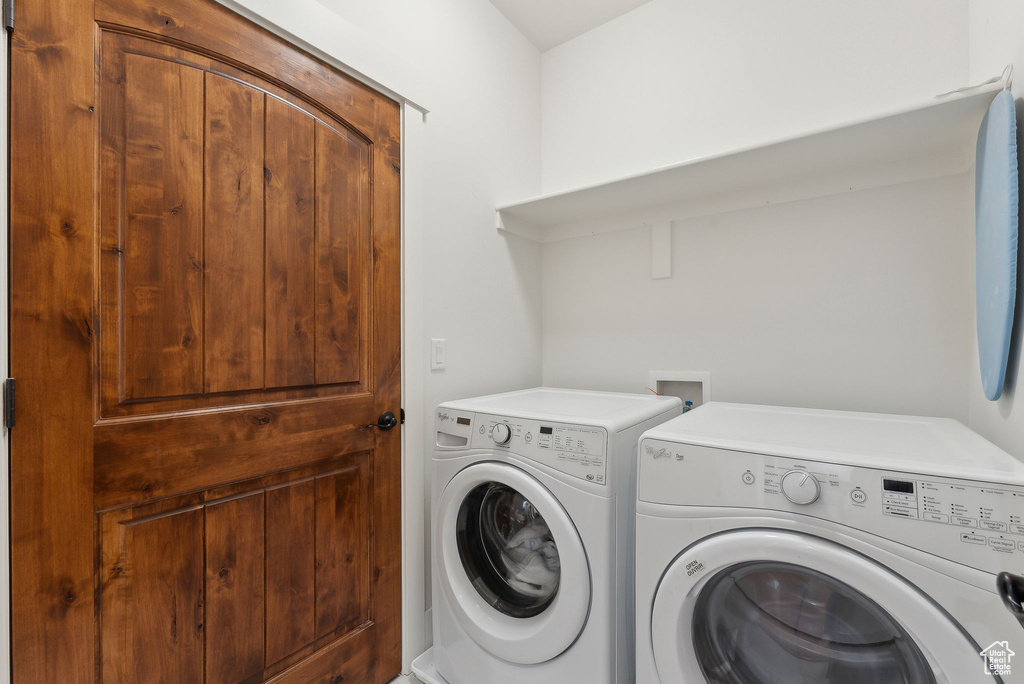 Washroom featuring independent washer and dryer