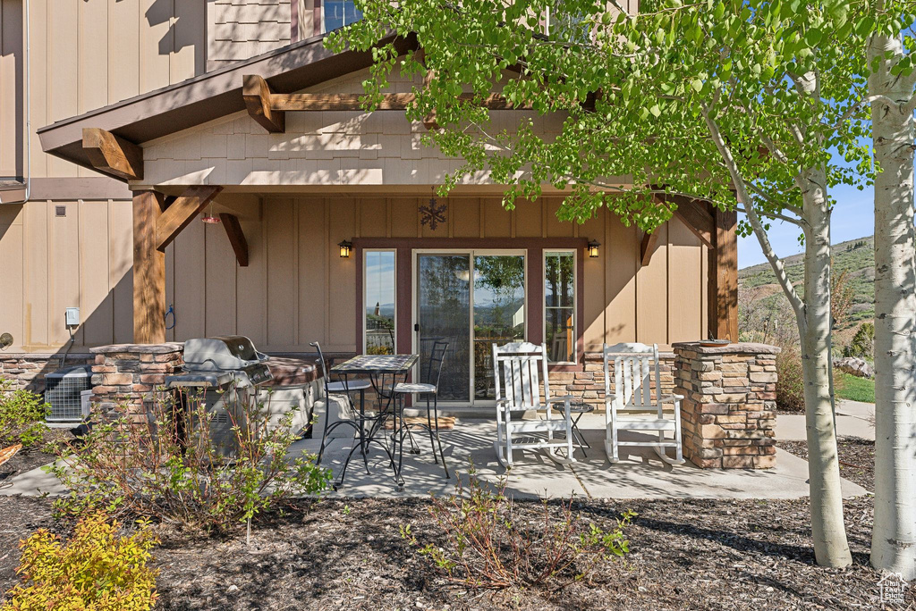 Rear view of property with a patio