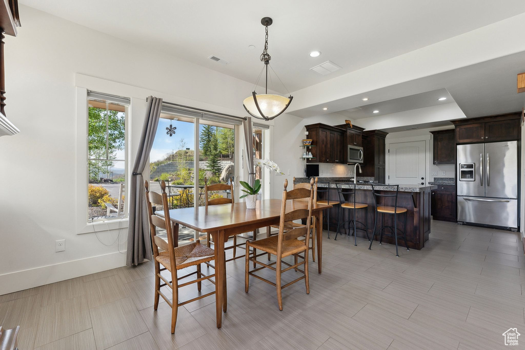 Dining area featuring baseboards and recessed lighting