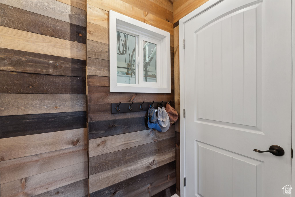 Bathroom featuring wooden walls