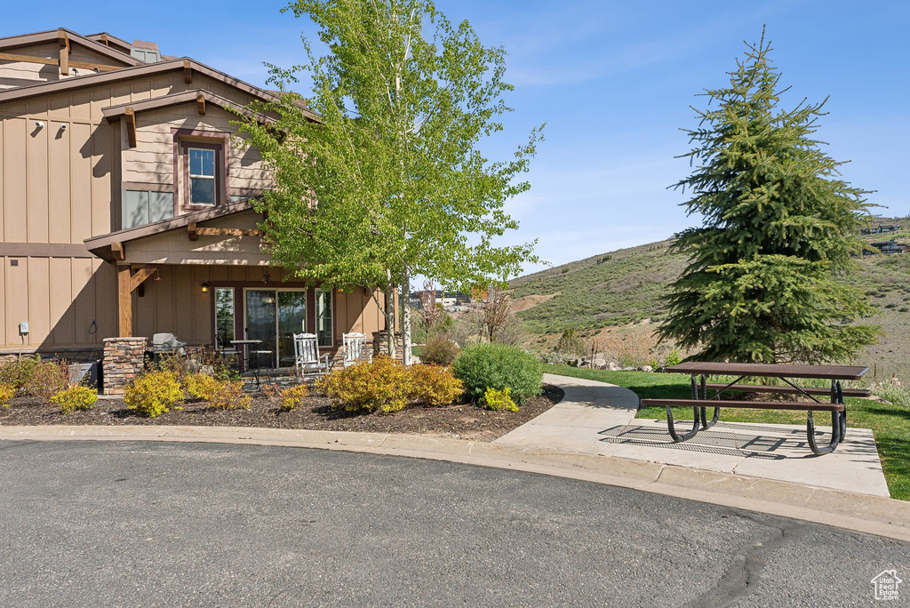 Exterior space featuring board and batten siding and a mountain view