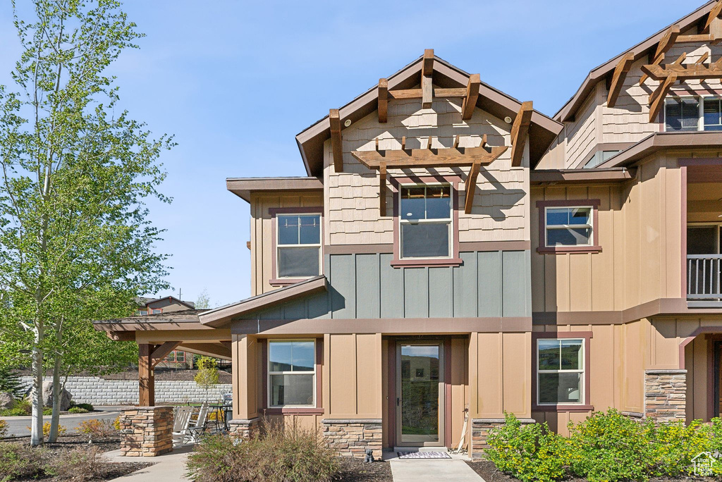 Multi unit property with board and batten siding and stone siding