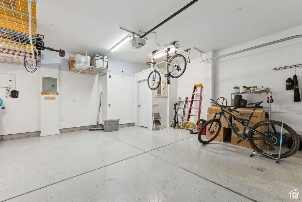 Garage with a garage door opener and electric panel