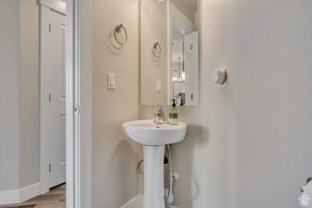 Bathroom featuring baseboards and wood finished floors