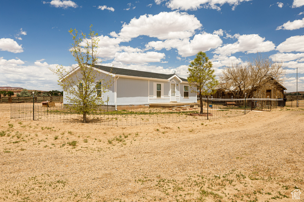 Back of house with fence