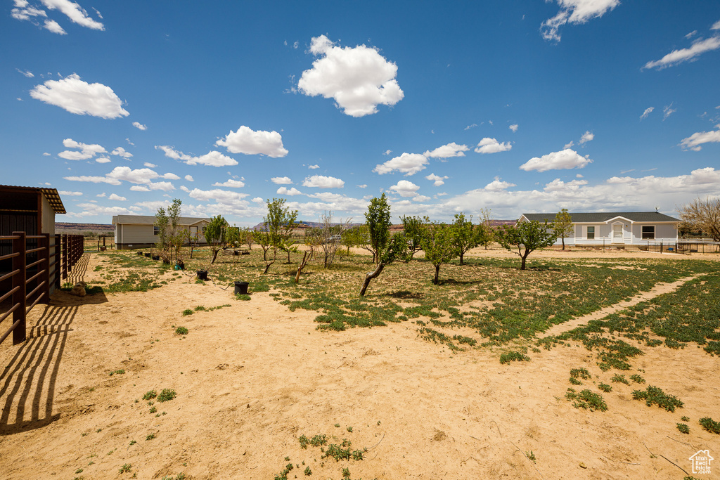 View of yard featuring fence