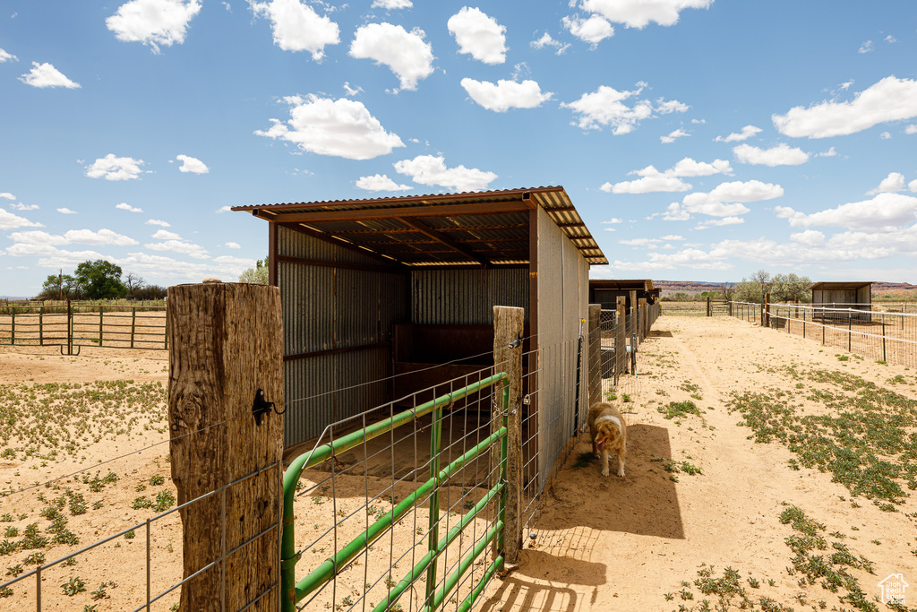 View of outbuilding featuring a view of countryside, an exterior structure, and an outbuilding