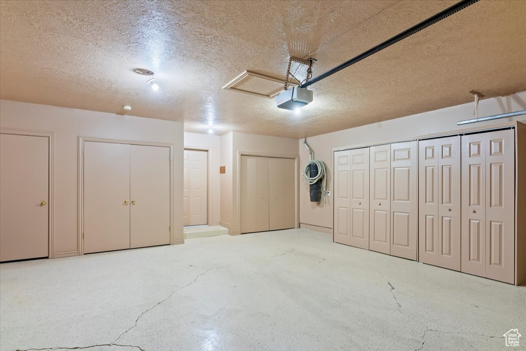 Garage featuring a garage door opener