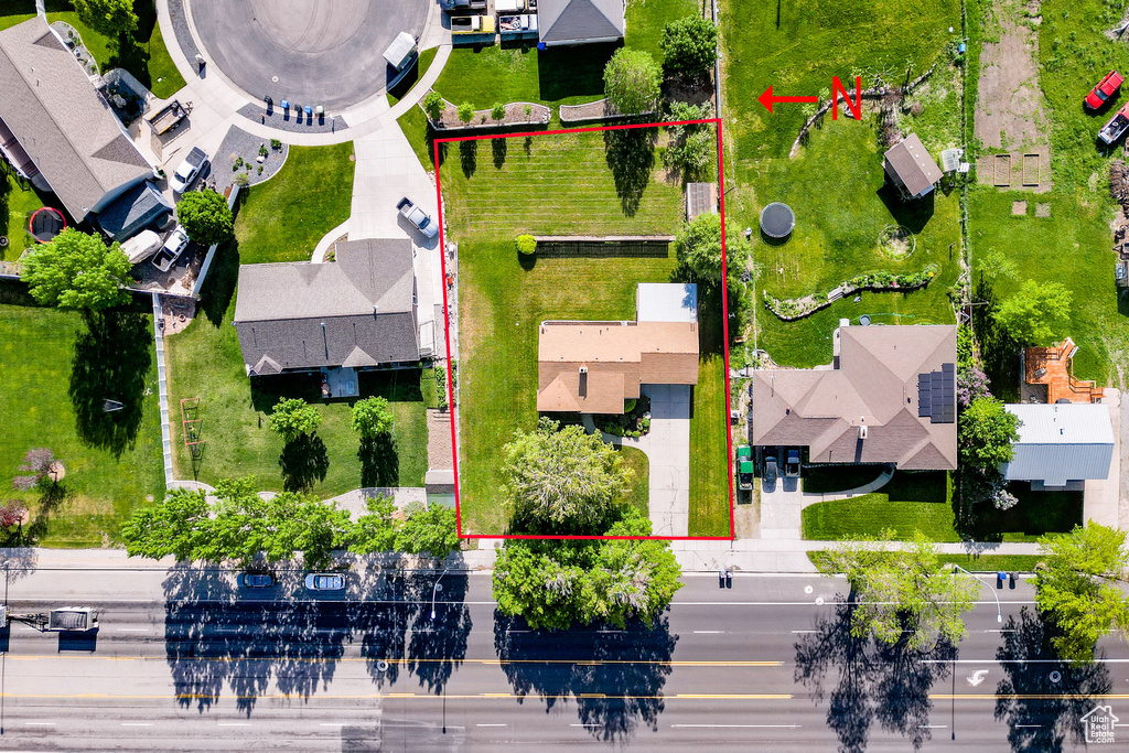 Aerial view of residential area with property boundaries highlighted