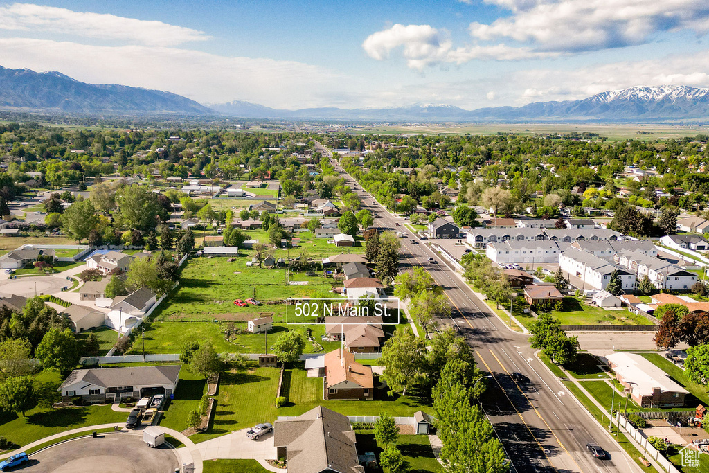 Aerial perspective of suburban area featuring a mountainous background