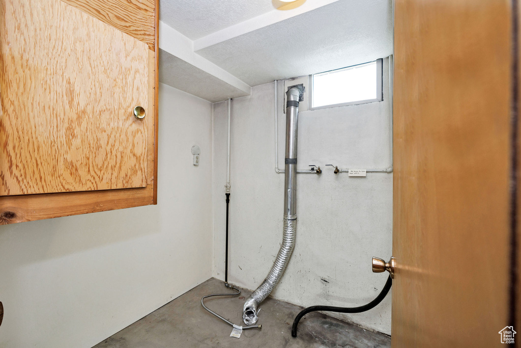 Bathroom featuring unfinished concrete floors
