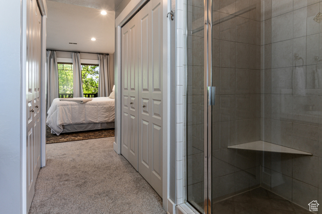 Full bath with a shower stall, ensuite bathroom, and recessed lighting