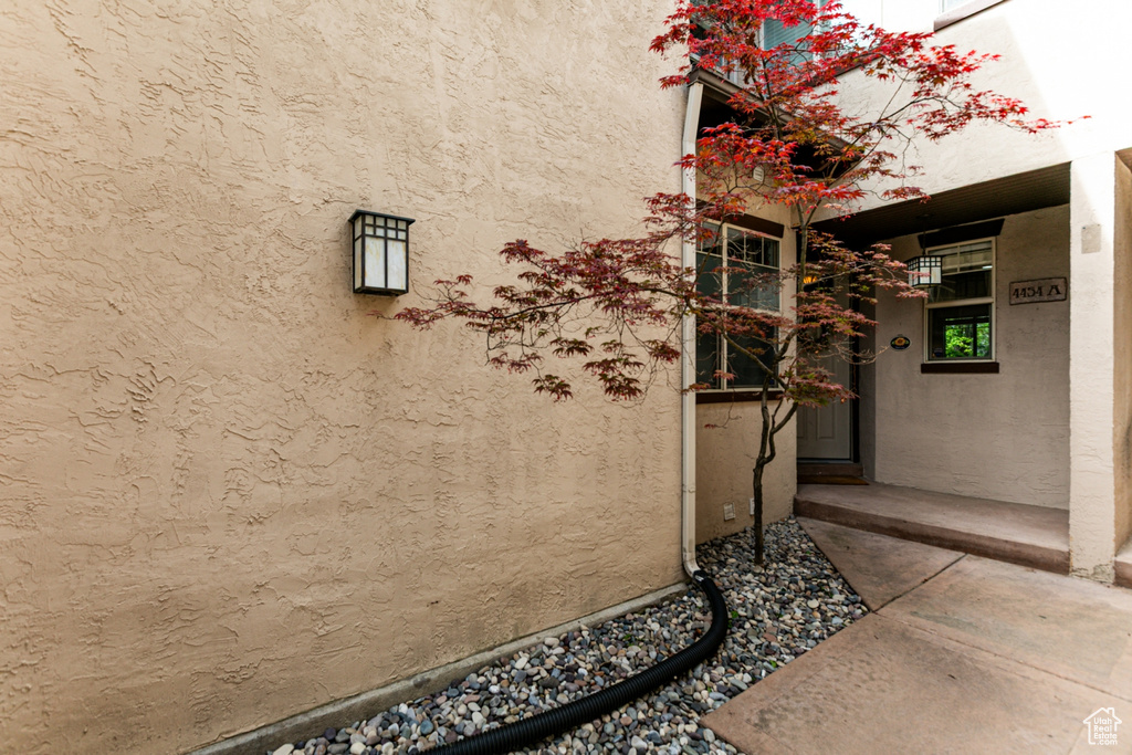View of side of home featuring stucco siding