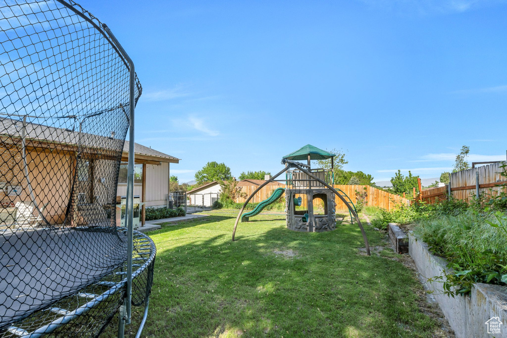 View of yard with a trampoline