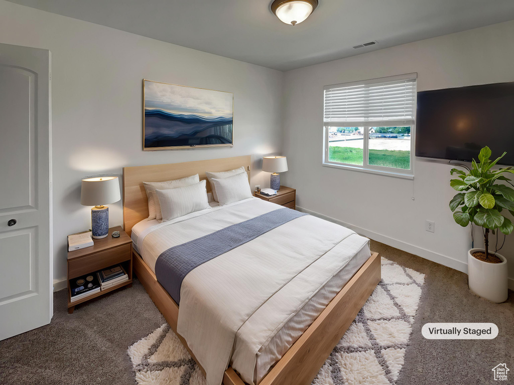 Bedroom with carpet and baseboards