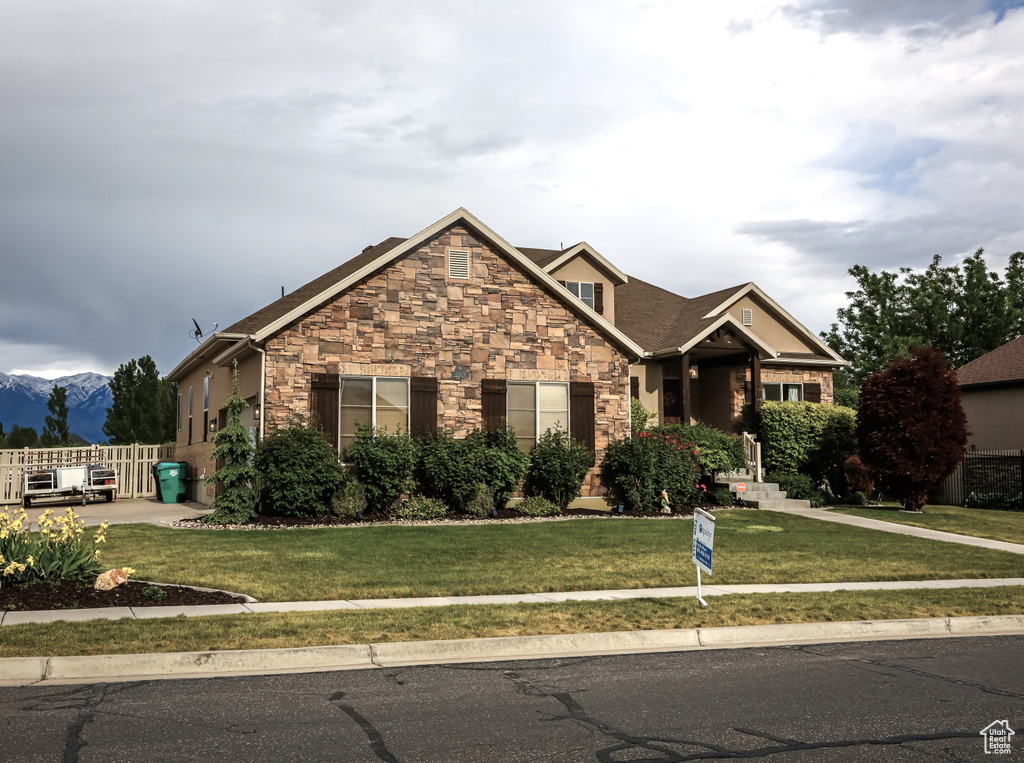 Craftsman house featuring stone siding and a mountain view