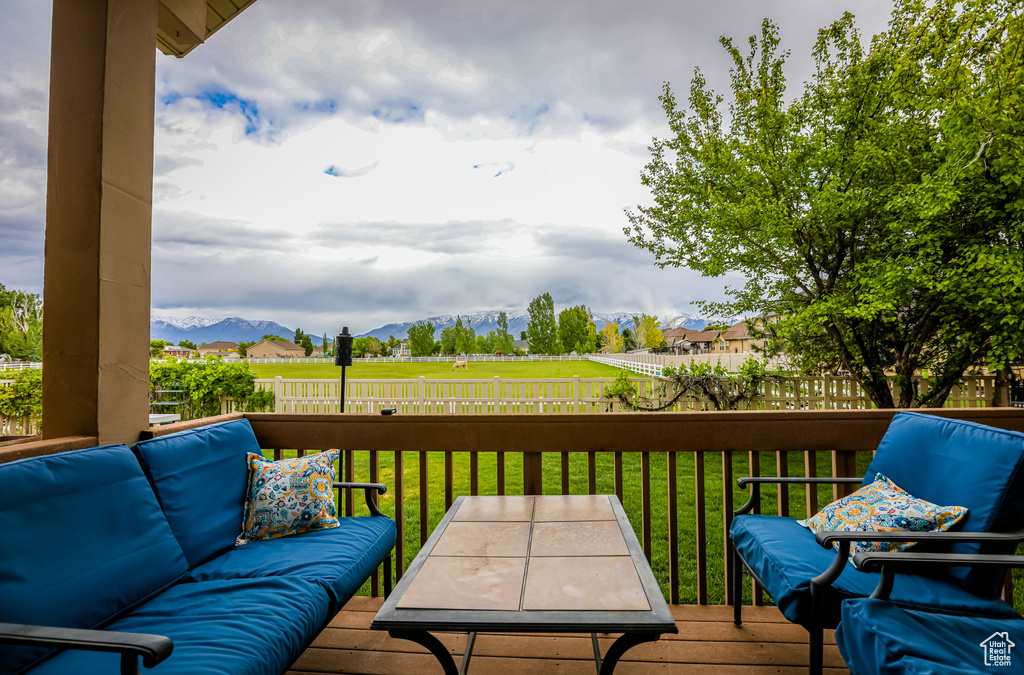 Wooden deck with a mountain view and an outdoor hangout area