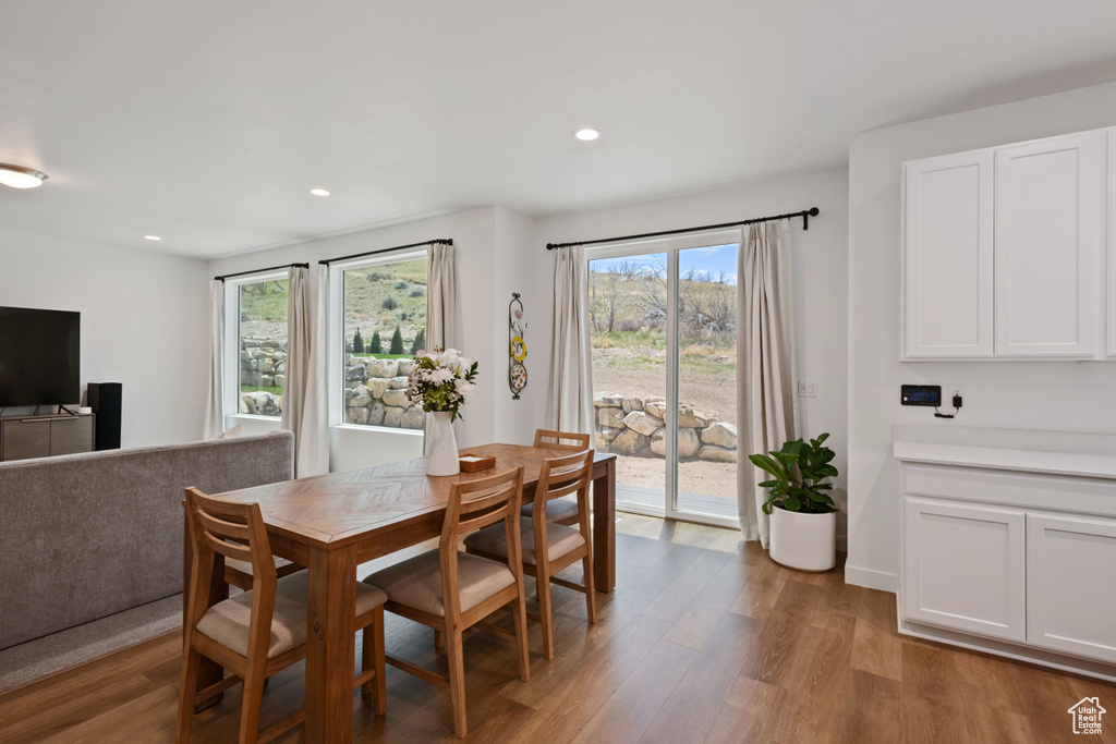 Dining space featuring light wood finished floors and recessed lighting