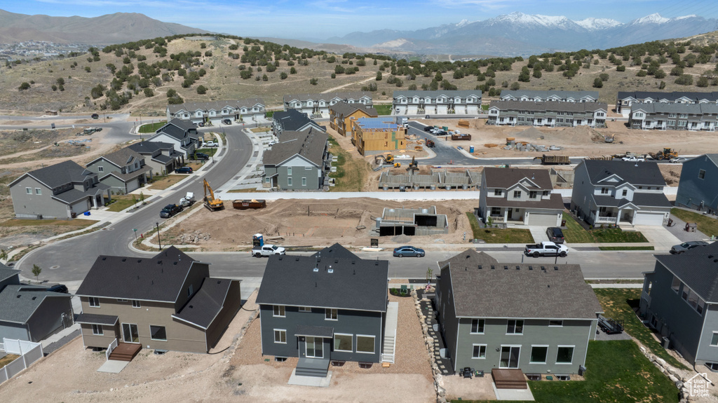 Aerial view of residential area featuring a mountain backdrop