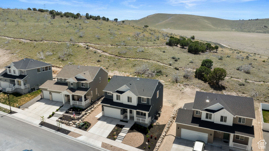 Aerial view of residential area featuring a mountain backdrop