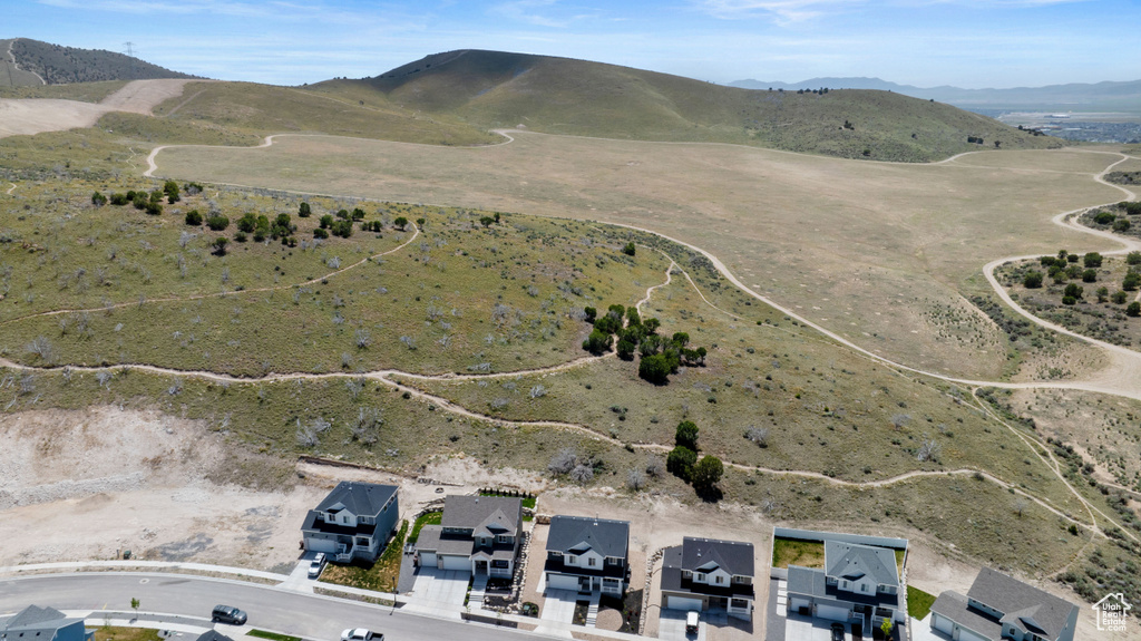 Aerial view of property\'s location with a mountainous background