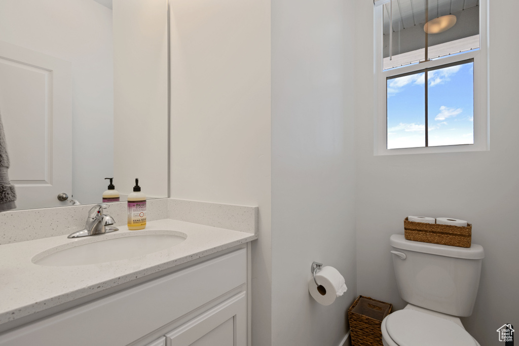 Bathroom with toilet and vanity