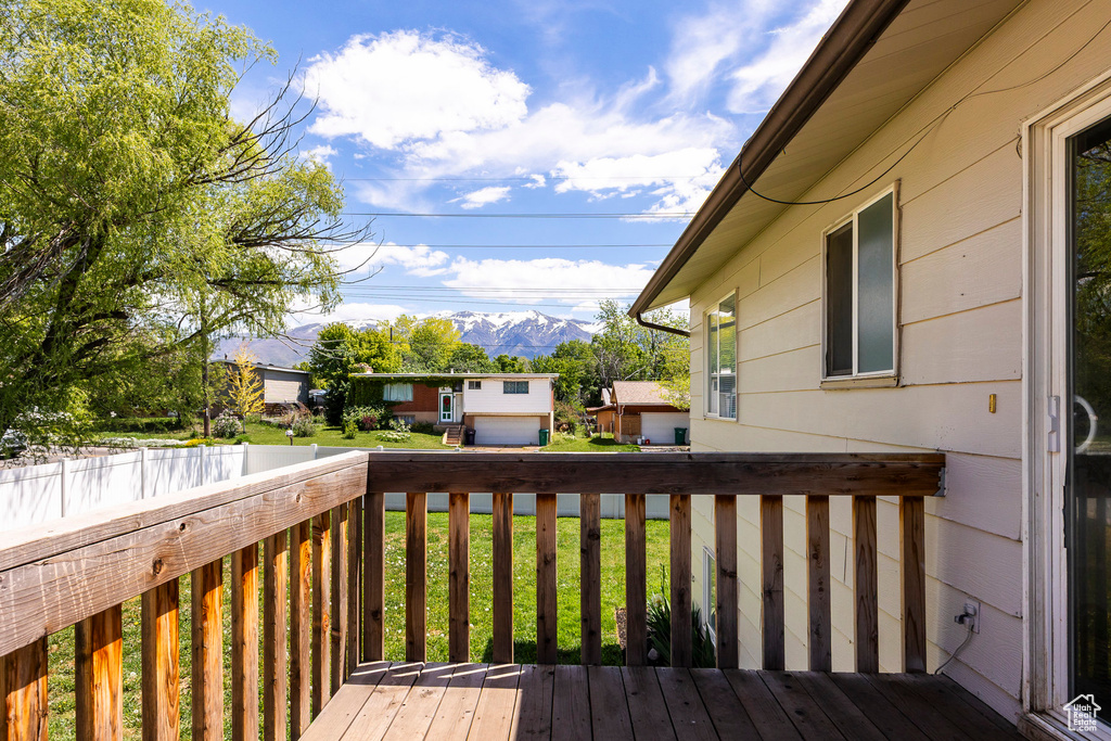 Wooden terrace featuring a mountain view